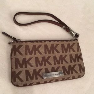 Michael Kors wristlet w/ zipper. Never used